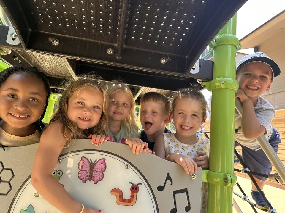 a group of kids playing together on the playground